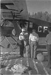 Loading a "Fairchild" Bellanca Aircraft [graphic material] 1933