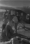 Loading a "Fairchild" Bellanca Aircraft [graphic material] 1933