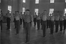 Physical exercises at Regina Depot [Royal Canadian Mounted Police (R.C.M.P.)] [graphic material] 1933.