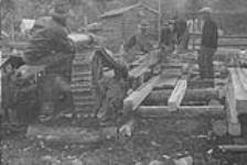 Working a sawmill with the help of a tractor near Great Slave Lake, N.W.T. [graphic material] 1933