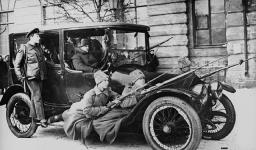 Group of armed Russian soldiers with automobile vers 1917