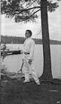 Unidentified man with tennis racket, Craigie Lea, Muskoka Lakes ca. 1907