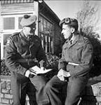 Maj. S.L. Dymond, Officer in Command, with Capt. A.R. Keiller, 2nd in command of the Esterwegen internment camp 30 Ot. 1945