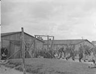 2nd Canadian Corps. Demobilization of high ranking Nazi officers and officials in internment camp. Prisoner officers and men now fitted into denims 8 June 1945