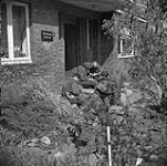 Infantrymen of The Lincoln and Welland Regiment preparing to pursue German paratroopers, Wertle, Germany, 11 April 1945 April 11, 1945.