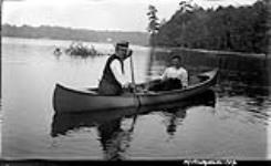 Unidentified couple in canoe ca. 1908