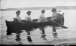 Unidentifiedg group of women in rowboat ca. 1908