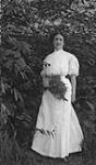 Unidentified woman in woods ca. 1908