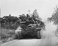 'Sherman' tank of the Ontario Regiment pursuing units of the Hermann Goering Panzer Division c.a. 18 July 1944