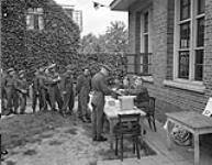 Infantrymen of The Argyll and Sutherland Highlanders of Canada outside a federal election polling booth, Almelo, Netherlands, 31 May 1945 May 31, 1945.