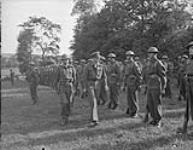 1st CANADIAN ARMY IN FRANCE. Prince Bernhard of the Netherlands accompanied by Capt. W. Gager inspects a Royal Canadian Army Service Corps guard of honour during his visit of Dutch troops in Normandy 23 Aug. 1944