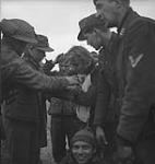 German prisoners prepared to carry a wounded man 8 Feb. 1945