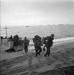Infantrymen of the 7th Canadian Infantry Brigade coming ashore from a Landing Craft Assault (LCA) during a training exercise, England, 12 April 1944 April 12, 1944.