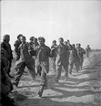 Members of German Luftwaffe division taken prisoner by 8th Infantry Brigade during attack on factory area near Caen 18-Jul-44