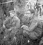 Two members of German Luftwaffe division taken prisoner by 8th Infantry Brigade during attack on factory area of Caen 18-Jul-44