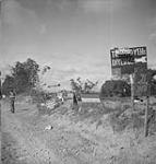 Allied military traffic signs at a road intersection 13-Jul-44