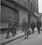 French officers on the street 11 July. 1944