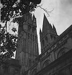 Exterior view of St. Etienne Church after bombardment 10 July. 1944