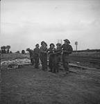 Sappers of the 16th Field Company, R.C.E., removing a damaged rail from the Paris-Cherbourg railway line 08-Jul-44