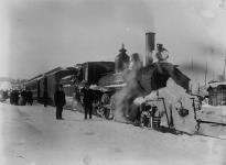 Grand Trunk Railway Locomotive No. 2481 and passenger train in snow ca. 1910 - 1913