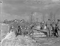 Personnel of No.152 Railway Company, British Army, constructing a railway between Gennep and Mook 9 Mar. 1945