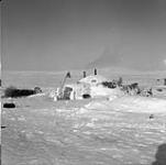 An Inuit encampment in the area in which the family is using an igloo rather than a caribou skin tent 1950