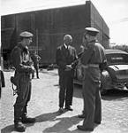 Dr. Immich, owner and managing director of the Deutsche-Werke, a firm manufacturing full-sized and miniature submarines at the Kiel shipbuilding yards, speaking to British officers 18 May 1945