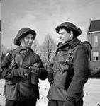 Company Sergeant-Major Paré and Sergeant R. Richards of the Régiment de la Chaudière examining a German Luger pistol, Bergendal, Netherlands, 24 January 1945 January 24, 1945