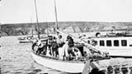 Group of Inuit on a schooner between 1926 and 1931