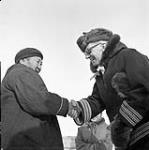 Governor General Vincent Massey during his Northern Tour shaking hands with Nellic, an 85 year old Inuk woman March 1956.