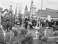 Brigadier W. Basil Wedd of Headquarters, 1st Canadian Army, placing a wreath on the graves of Canadian soldiers killed at Dieppe on 19 August 1942. Ambleteuse, France, 23 September 1944 September 23, 1944