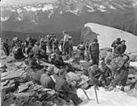 Canadian Army personnel resting on the summit of Mount Kerr during an alpine training course in the Yoho Valley, British Columbia, Canada, July 1943 July 1943.