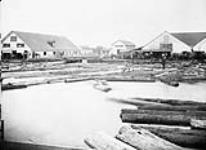 Lumber men in front of Gatineau Saw Mills sorting logs ca. 1885