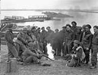 Sapper of the 29th, 30th and 31st Field Companies, Royal Canadian Engineers (R.C.E.), on the bank of the Rhine River, Rees, Germany, 30 March 1945 Marh 30, 1945