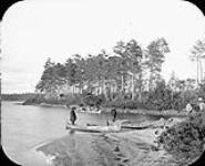 Men landing canoes ca. 1880's