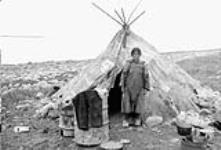 Typical Inuit "Tupik" (tent) with Inuit lady 1952 - 1953.
