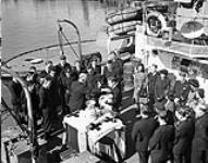 Christening of Lieutenant and Mrs. Shaw's child aboard H.M.C.S. QUINTE, Digby, Nova Scotia, Canada, 19 September 1944 September 19, 1944