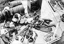 Personnel relaxing aboard H.M.C.S. OTTAWA, July 1944 July, 1944