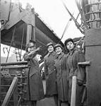 Unidentified members of the Canadian Women's Army Corps (C.W.A.C.) preparing to disembark from a troopship, Gourock, Scotland, 31 March 1943 March 31, 1943.