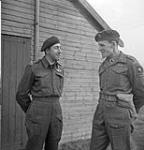 Army chaplain H/Captain G.A. Harris (left) talking with Brigadier S. James L. Hill, Commander, 3rd Parachute Brigade, 6th Airborne Division (British Army), Carter Barracks, Bulford, England, December 1943 December, 1943.
