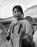 Young Inuit mother with child in the back n.d.