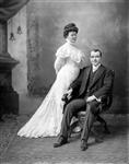 Mr. J.B. McRae sitting, woman standing beside him Jan. 1909