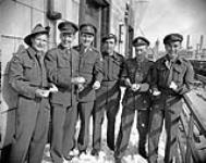 Six members of the Special Operations Executive (British Army), returning from duty in Burma and Southeast Asia aboard H.M.T. QUEEN ELIZABETH, New York, New York, United States, 20 February 1946 February 20, 1946.