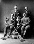 Curling Champions: Winners of the Grand Challenge Cup Season 1907-1908. Arthur Wilson, Second; Robert M. Lindsey, Lead; O.S. Finnie, Skip 1907-1908