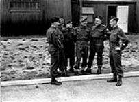 Group of Canadian senior non-commissioned officers who have just graduated from their British parachute course at No.1 Parachute Training School, Ringway, England, and are now at a Non-Effective Transit Depot (N.E.T.D.), England, 12 September 1942 September 12, 1942.