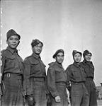 Five Chinese-Canadian soldiers who served with the South East Asia Command (SEAC) as guerilla fighters an are awaiting repatriation to Canada, No.1 Repatriation Depot (Canadian Army Miscellaneous Units), Tweedsmuir Camp, Thursley, England, 22 November 1945 November 22, 1945.