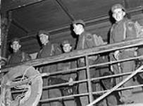 Unidentified personnel of the 13th Infantry Brigade Group disembarking from a United States transport returning from Operation COTTAGE, the attack on Kiska. British Columbia, Canada, ca. November 1943 - January 1944 ca. November 1943 - January 1944.