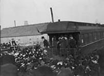 Sir Wilfrid Laurier speaking from the platform of a railway observation car during the federal election campaign Nov. 3, 1904