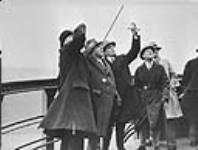 Rt. Hon. W.L. Mackenzie King (second from left) at the top of the airship mooring mast during the Imperial Conference 17 Nov. 1926