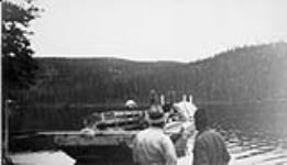 Settlers arriving from the Peace River, Alberta by scow, Great Bear Lake, Northwest Territories c 1930